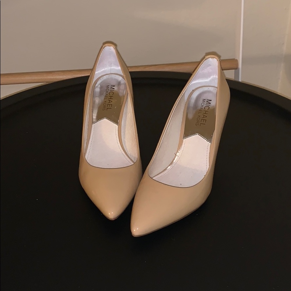 Michael Kors nude patent leather pumps.